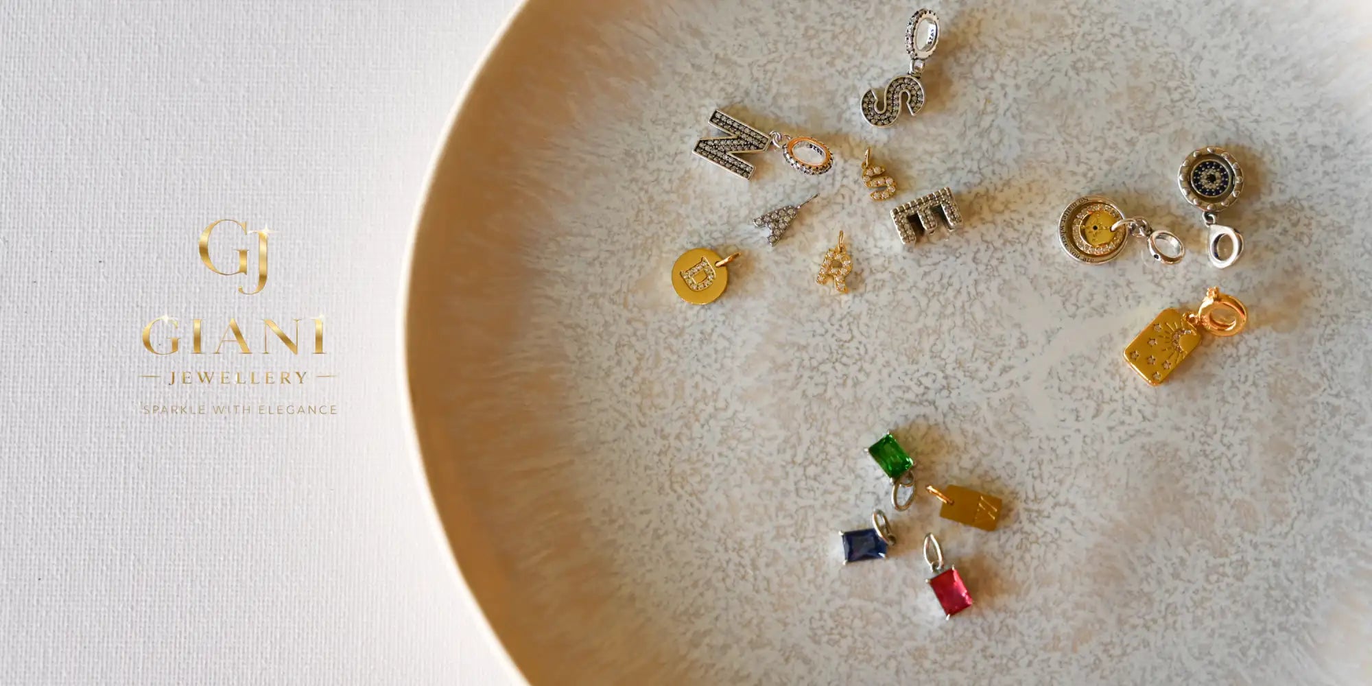 A collection of colorful, metallic charm pendants in various shapes and designs.