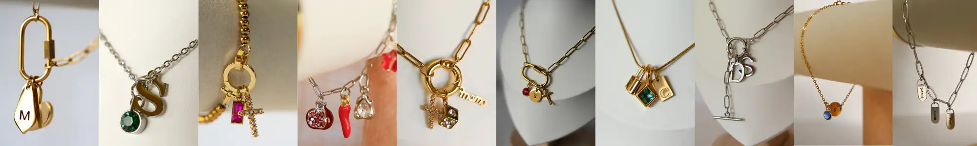 Gold-toned chain necklaces featuring various charms including initials, symbols, and decorative elements.