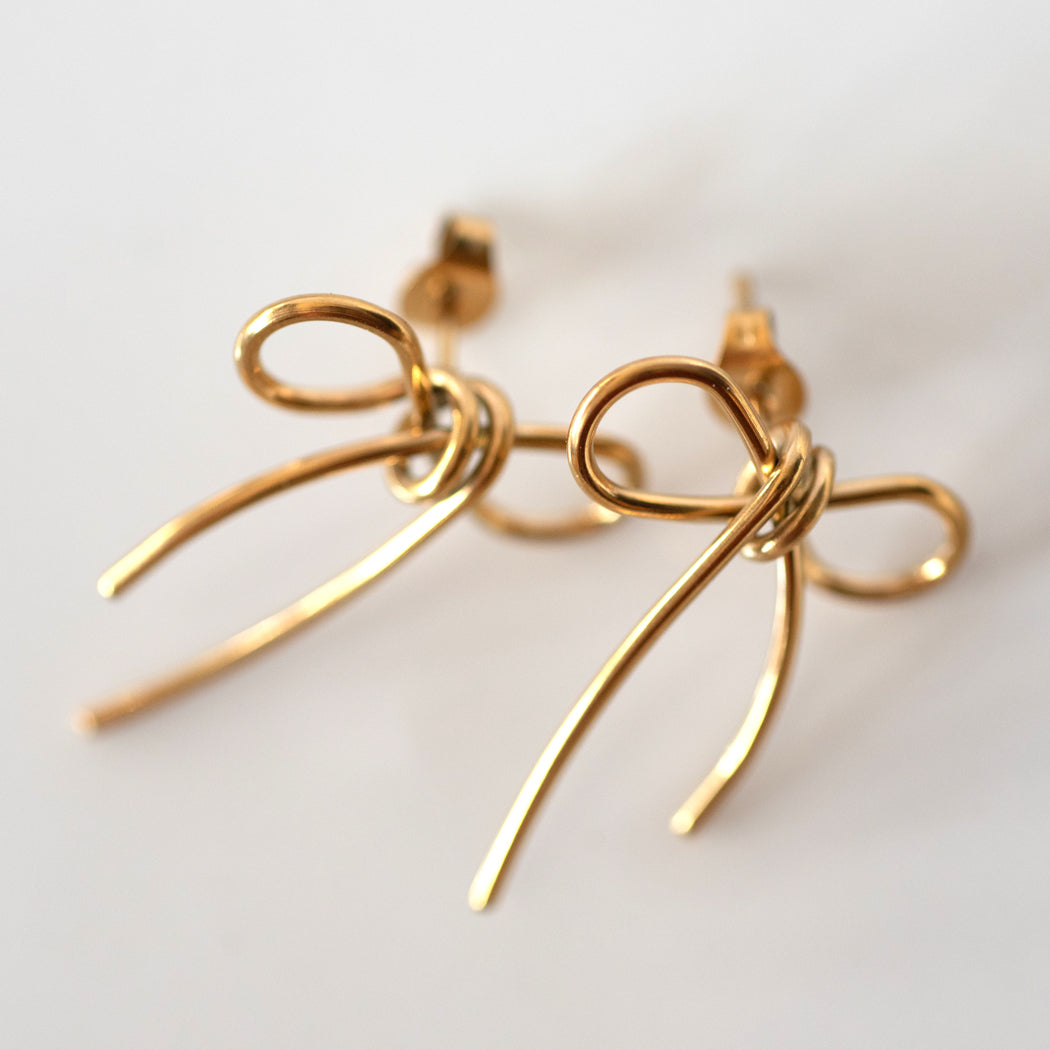 Golden bow stud earrings - Earrings
