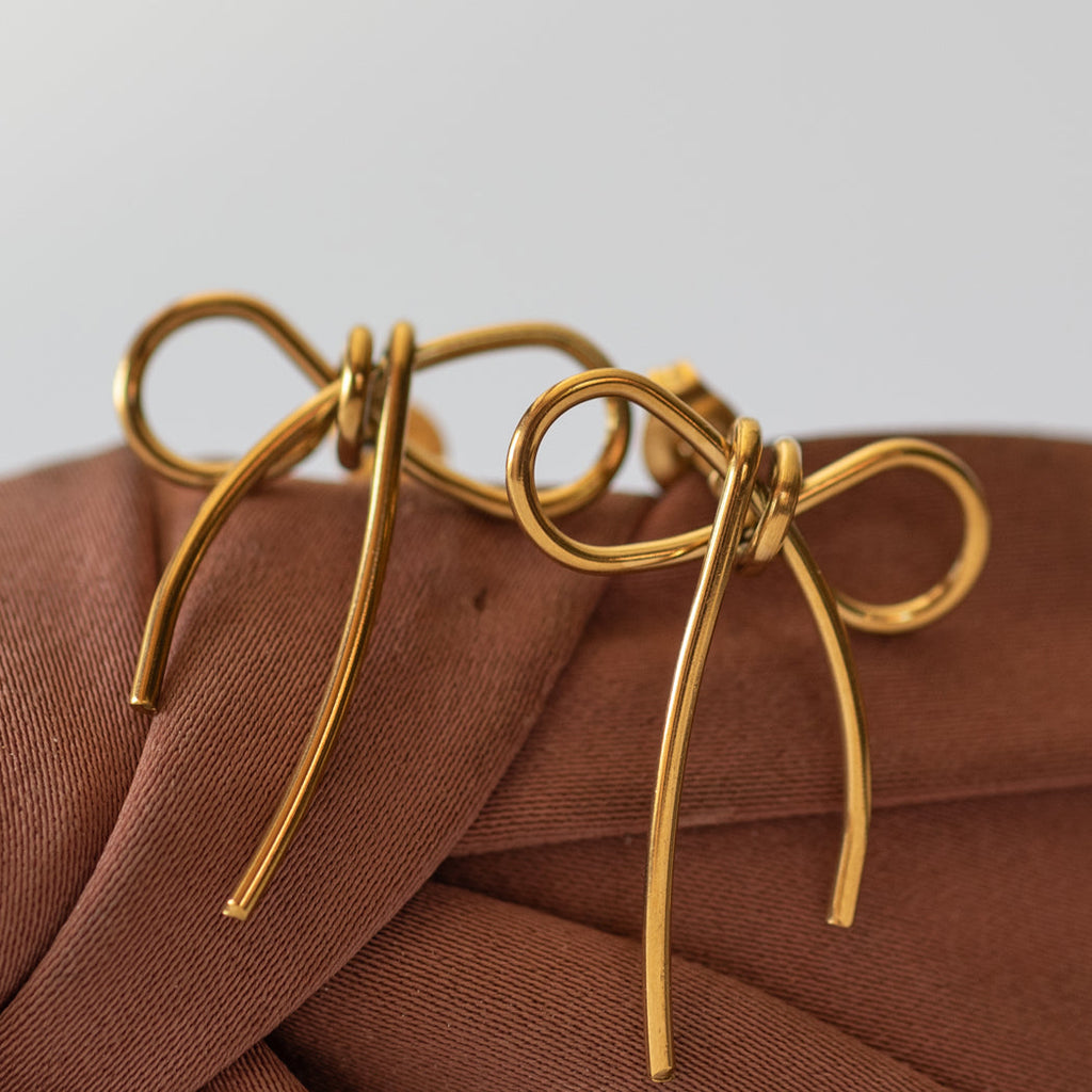 Golden bow stud earrings - Earrings