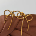 Golden bow stud earrings - Earrings
